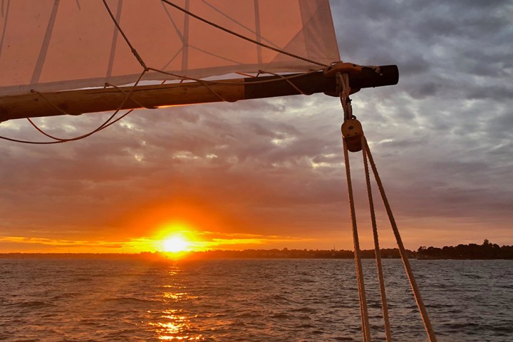 a sunset over a body of water